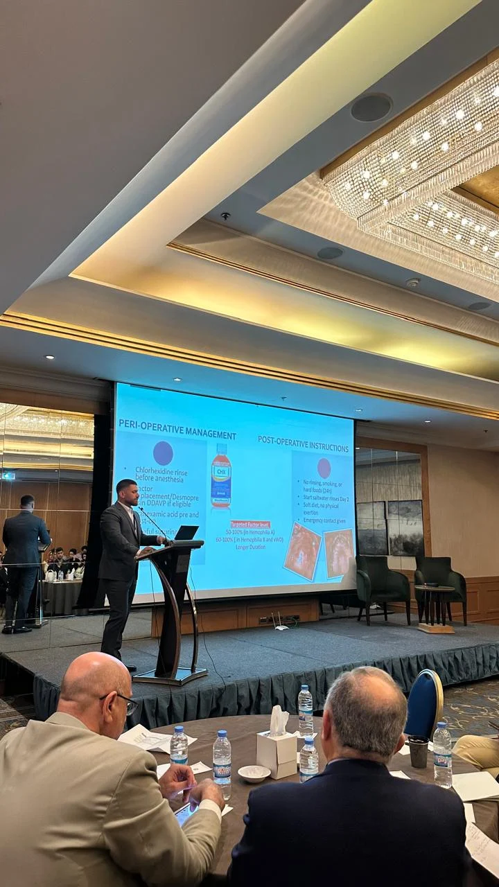 Dr. Abed Khabbaz presenting peri-operative dental management at a medical conference