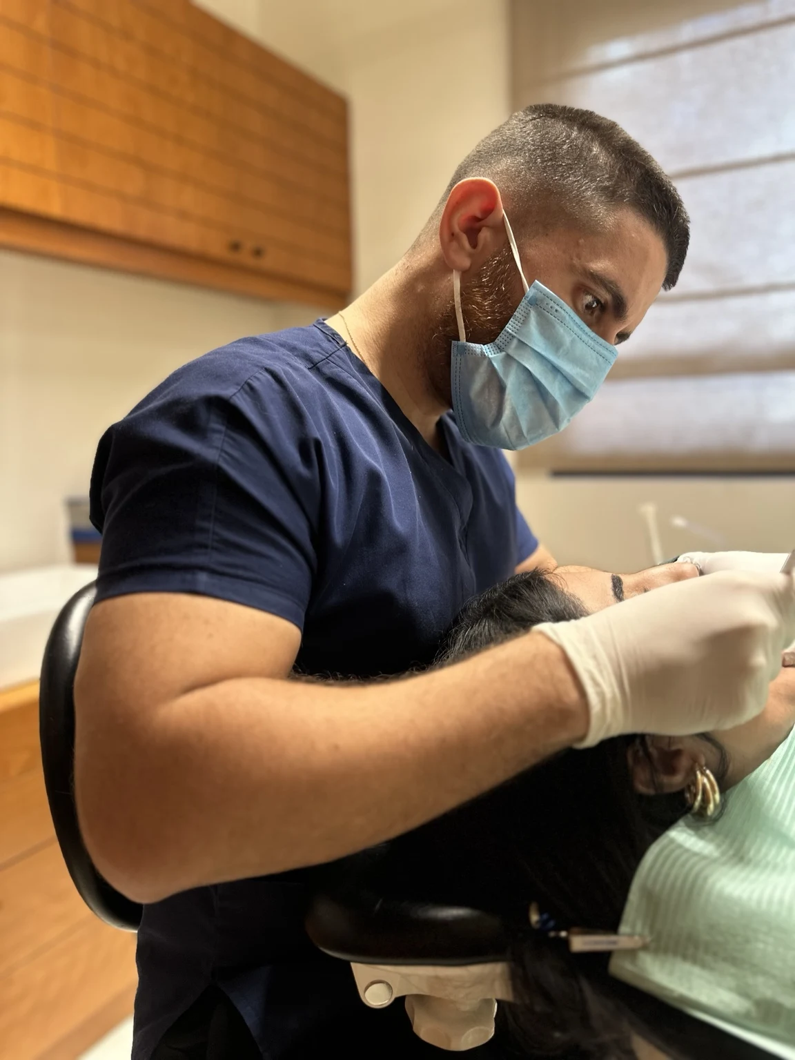 Dr. Abed Khabbaz providing dental treatment at his Hamra clinic
