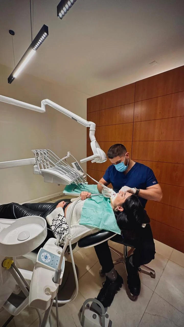 Dr. Abed Khabbaz providing dental care in the clinic